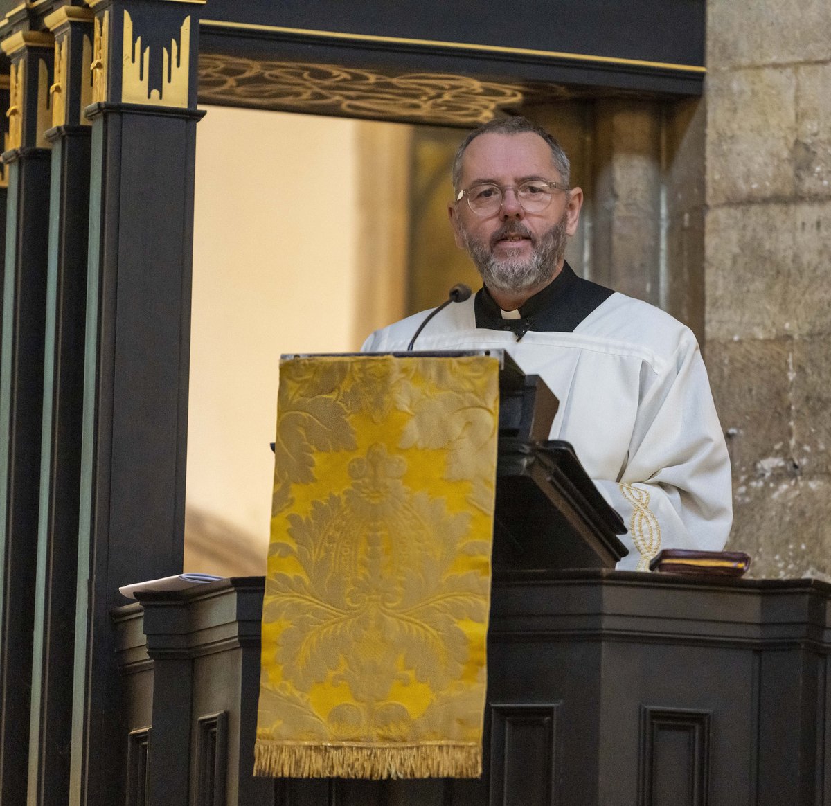 Dean of Llandaff Canon Richard Peers preaching from a pulpit