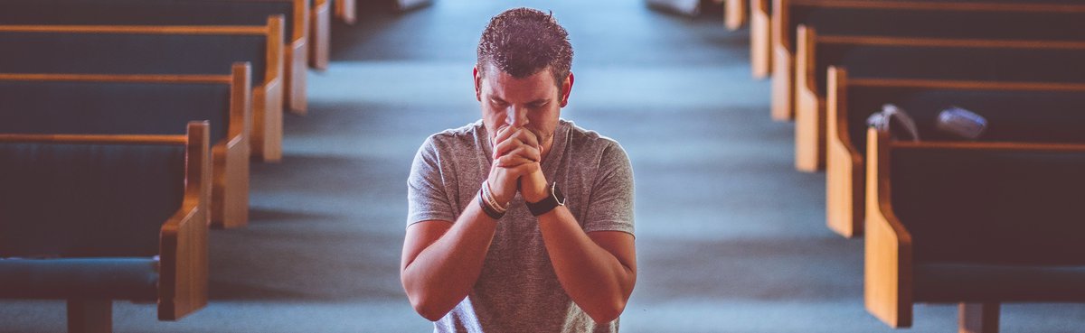 Man praying in church