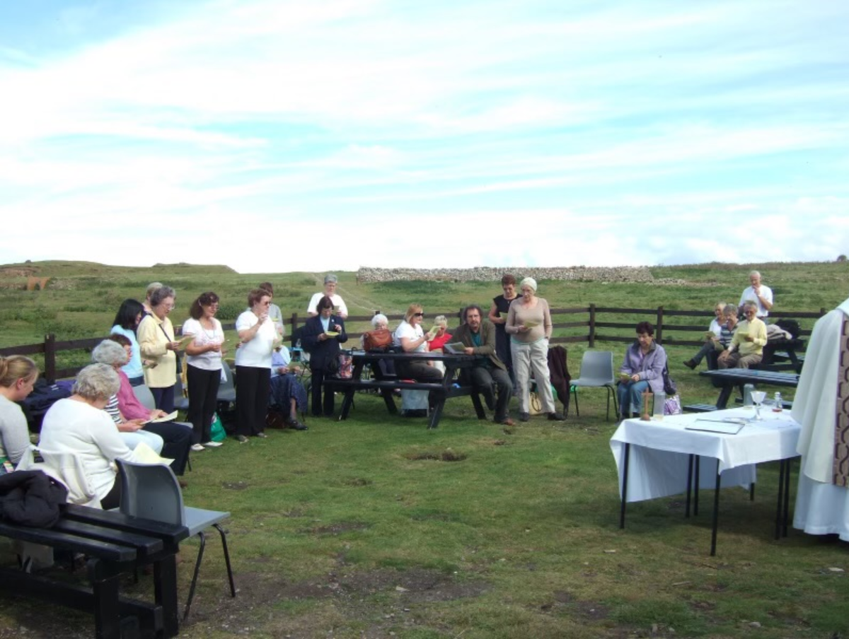 Modern day pilgrims on Flat Holm Island sat in a circle for a service