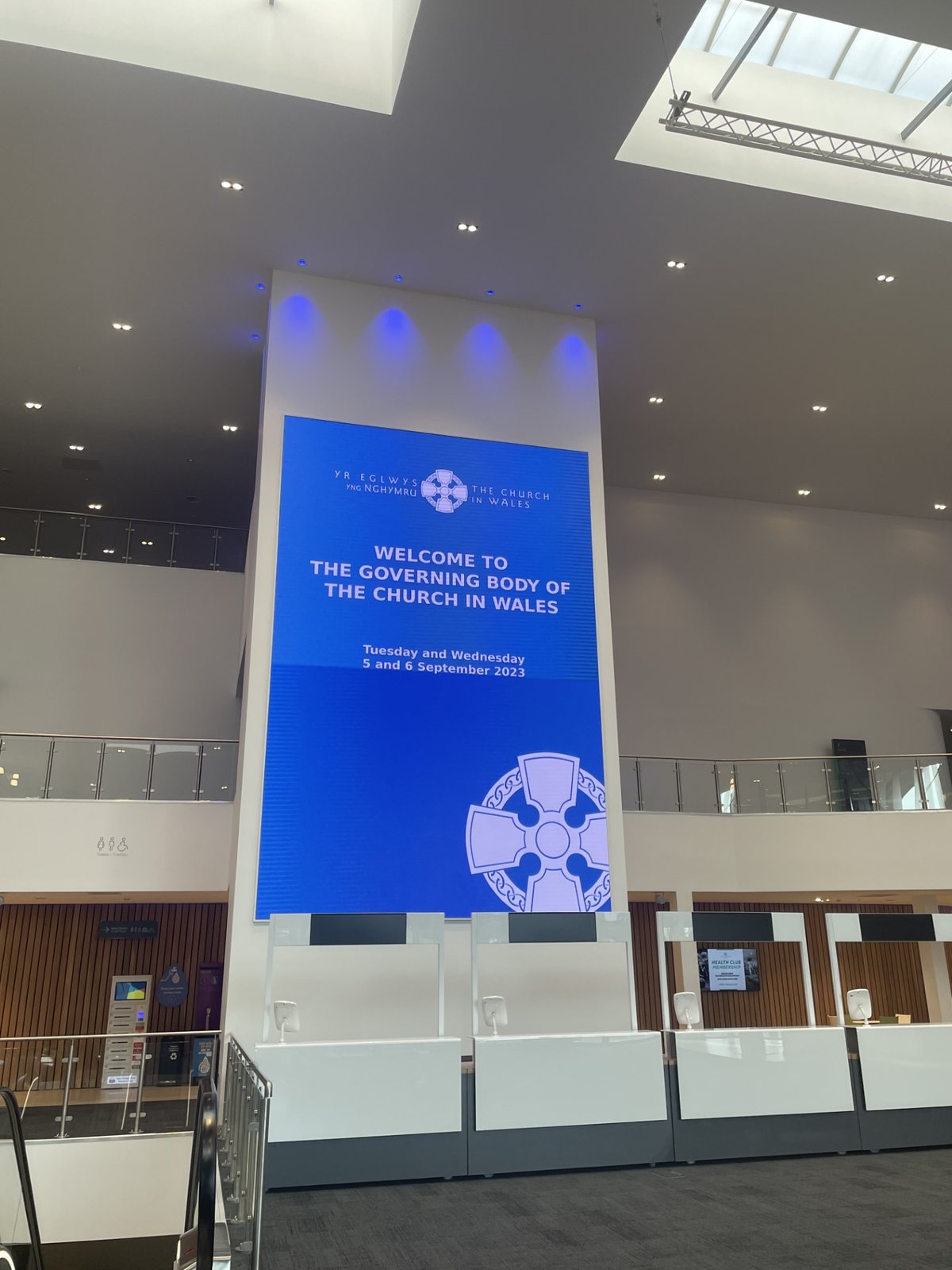 A large projection onto a wall welcomes delegates to the Governing Body