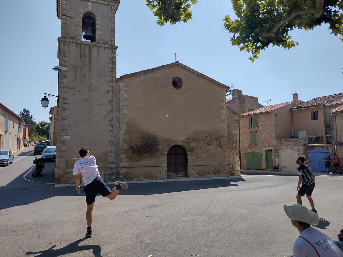 Handball being played against a church wall