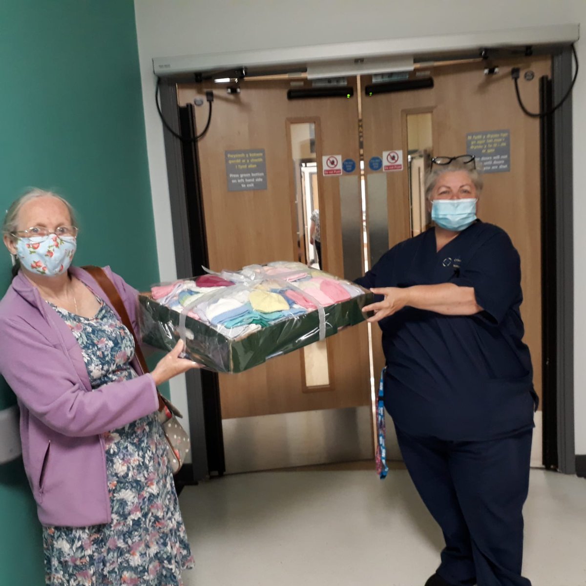 Liz Lewis, Knit n Natter member, and  Andrea, Midwife at Prince Charles Hospital, Merthyr Tydfil.