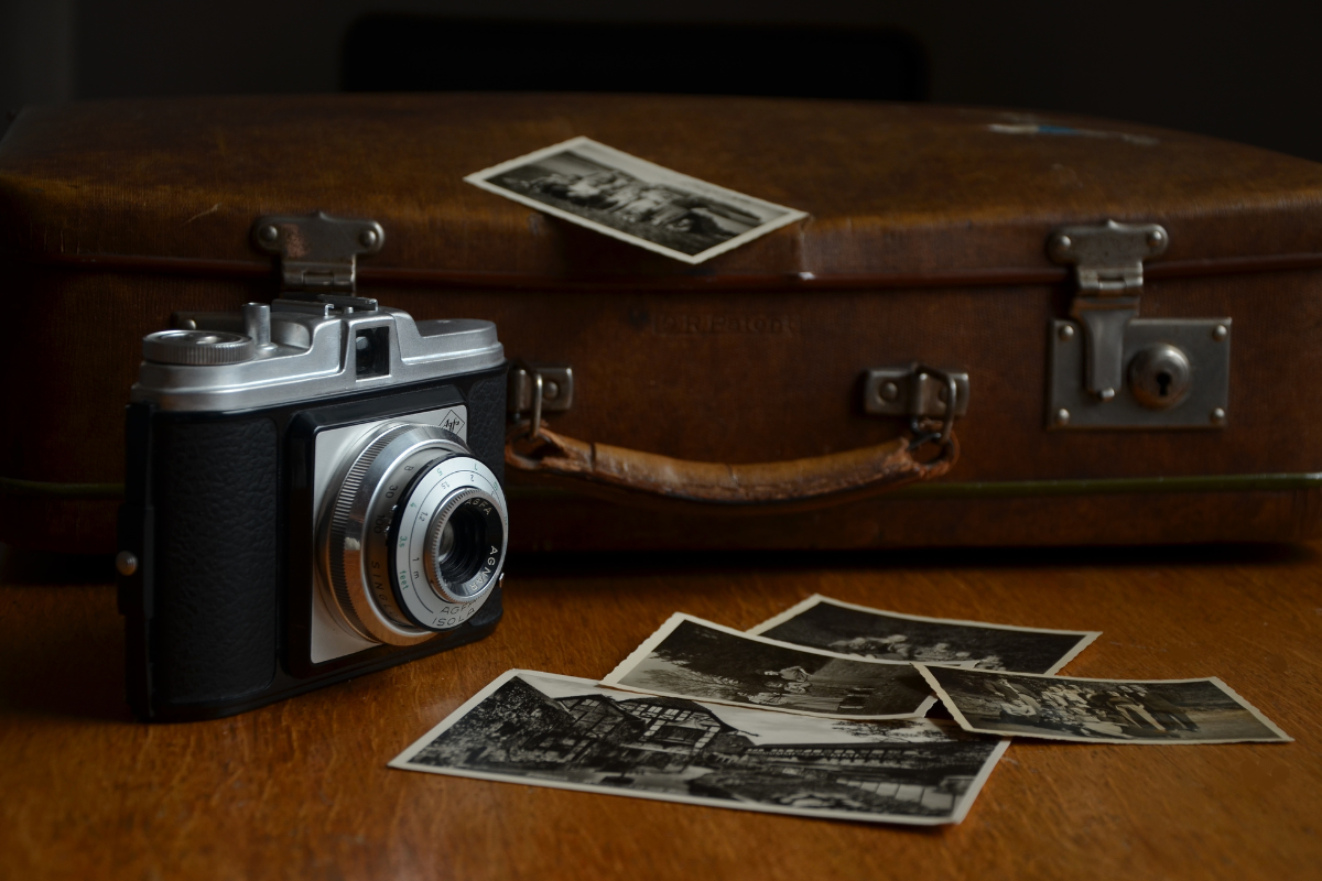 1940s camera, old brown suitcase, black and white photos