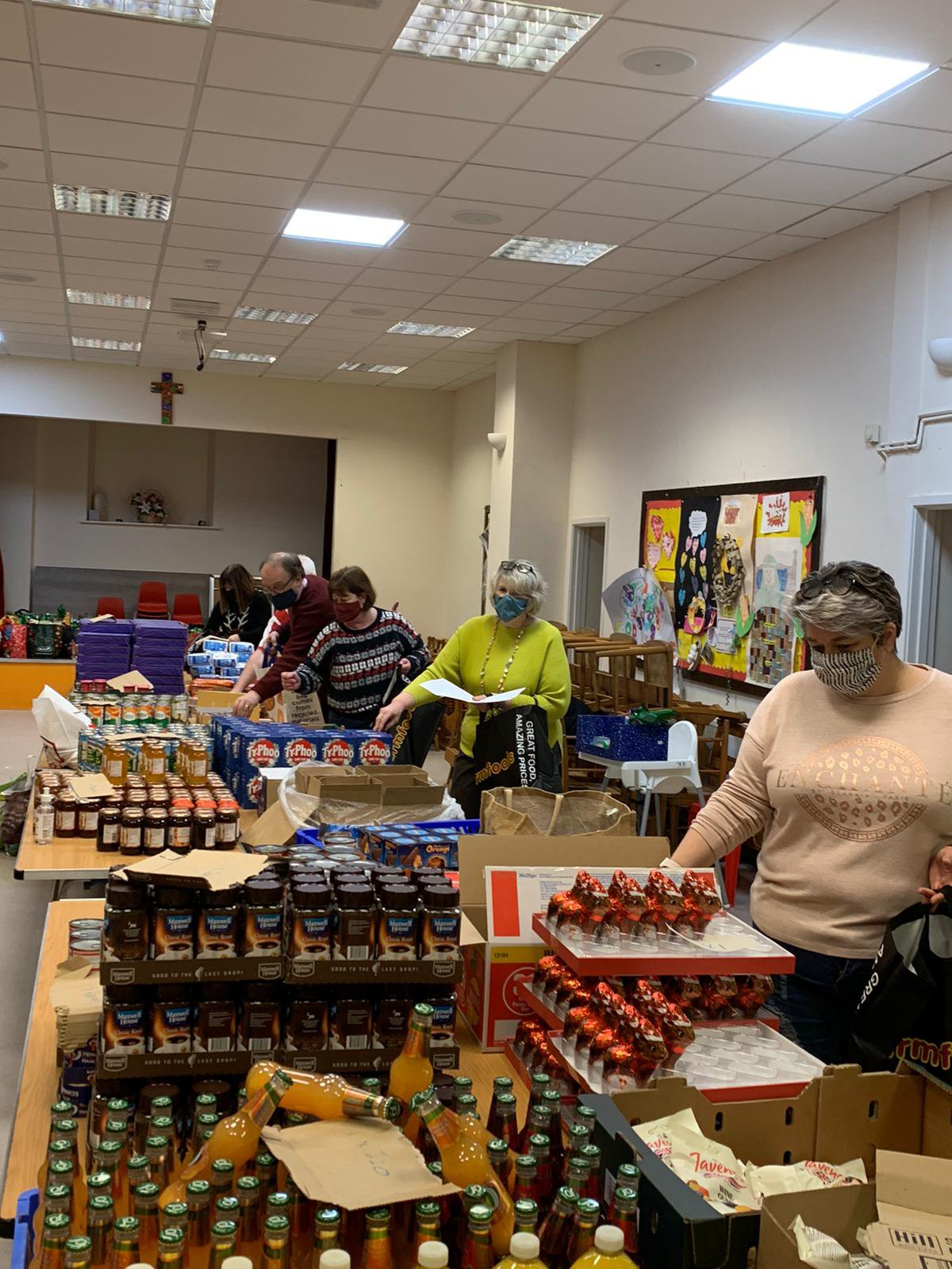 People packing food and drinks for the bags of joy initiative