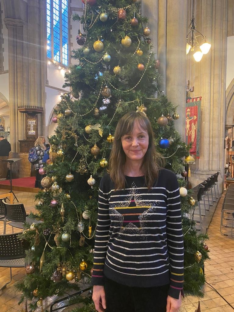 Rachel Kilby in front of Christmas tree in St Germans