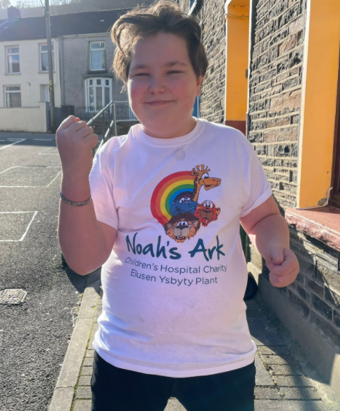 Alfie in a white Noah's Ark t-shirt