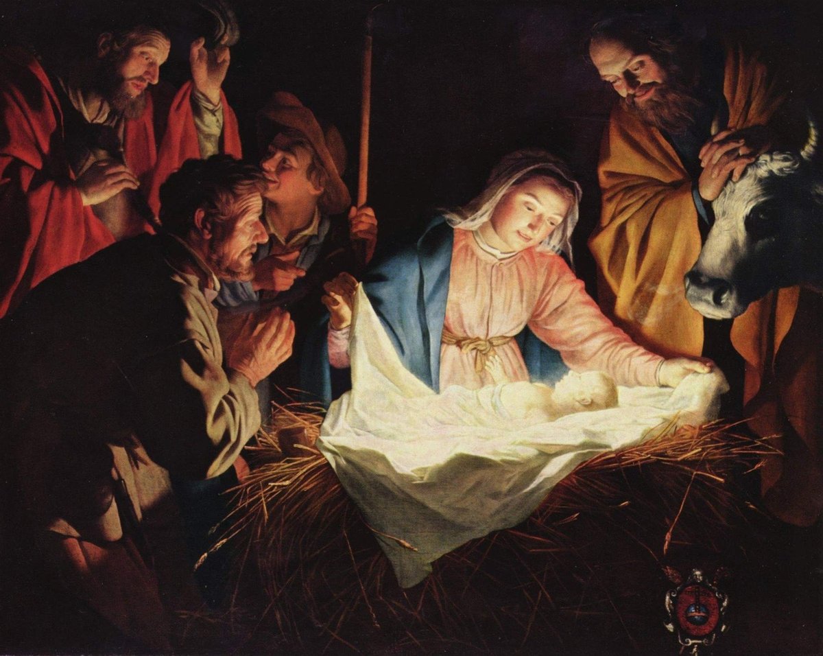 Jesus in a manger with light shining on him