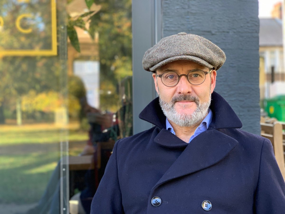 Revd Gareth Rayner-Williams in a flat cap and jacket