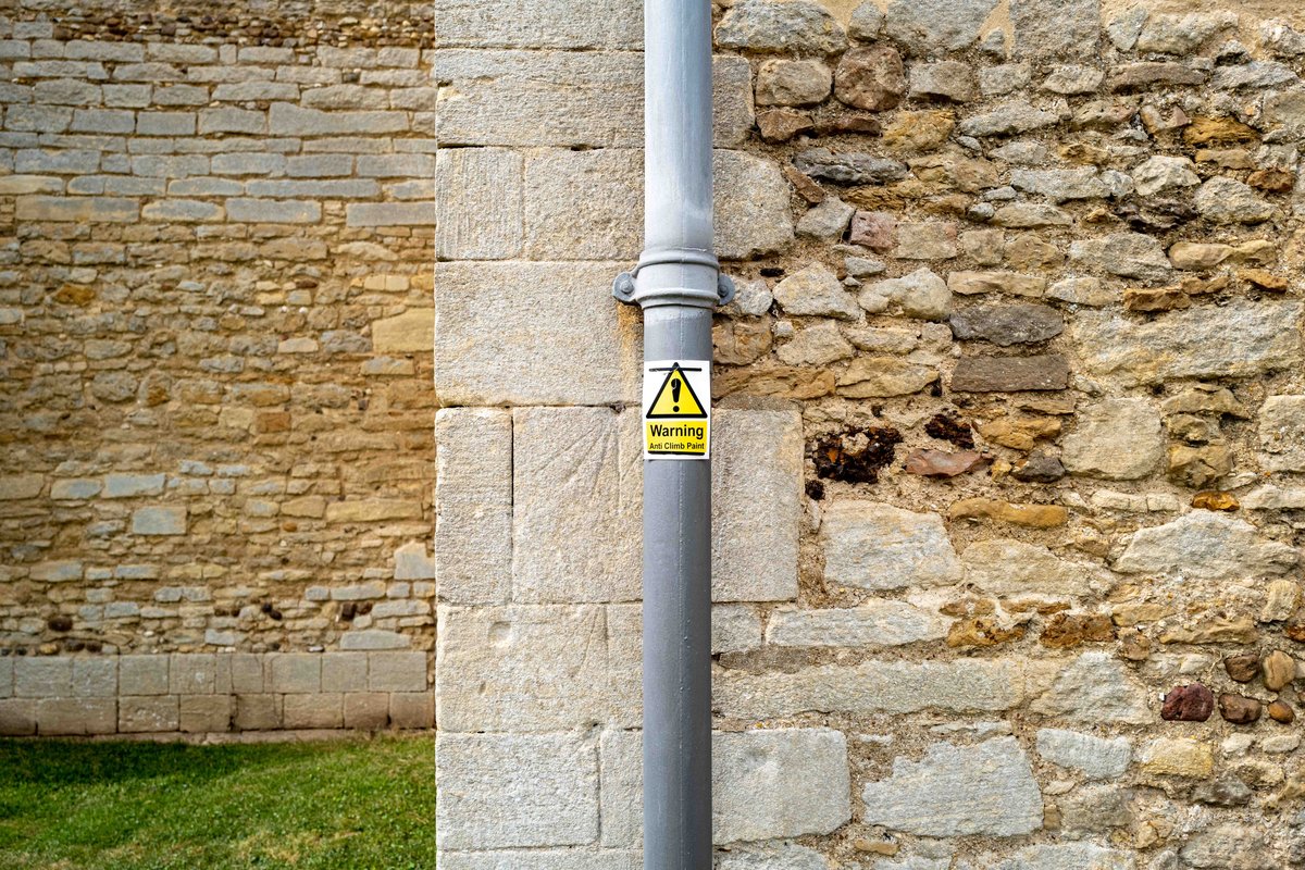 Outdoor metal pipe with warning sign
