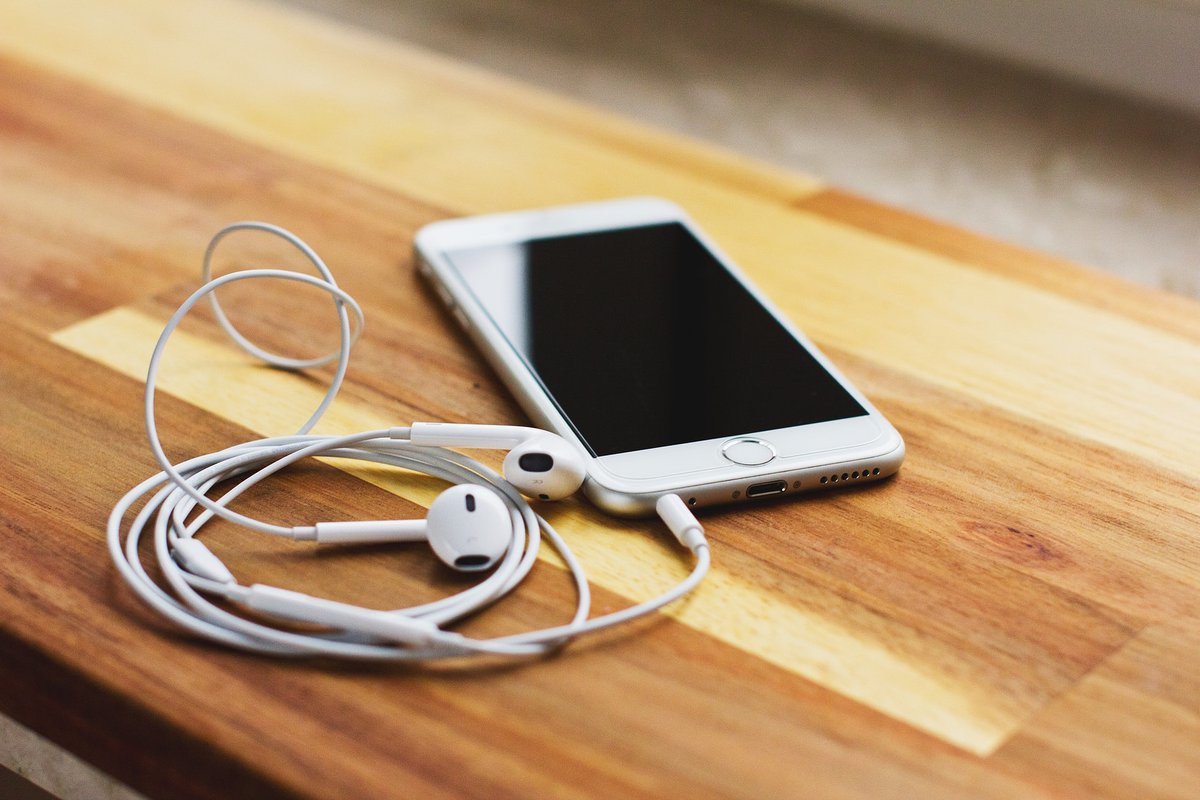 Phone and headphones for listening to a podcast